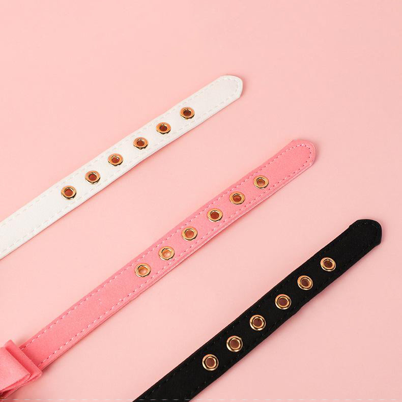 Sensory PU leather collar with bow and bell for intimate play.
