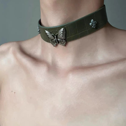 Dark green velvet choker with metallic butterfly accent